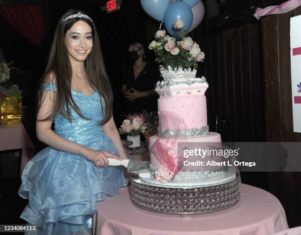 Sasha Anne cuts her cake at her 22nd Birthday Celebration held at Vitello's on July 20, 2021 in Studio City, California.