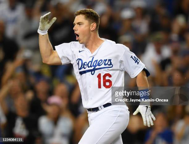Will Smith of the Los Angeles Dodgers heads to the plate after hitting a walk off three run home run in the ninth inning of the game against the San...