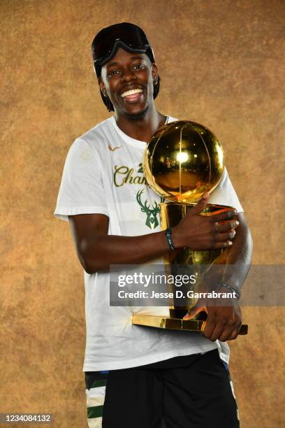 Jrue Holiday of the Milwaukee Bucks poses for a portrait with the Larry O'Brien Trophy after winning Game Six of the 2021 NBA Finals against the...