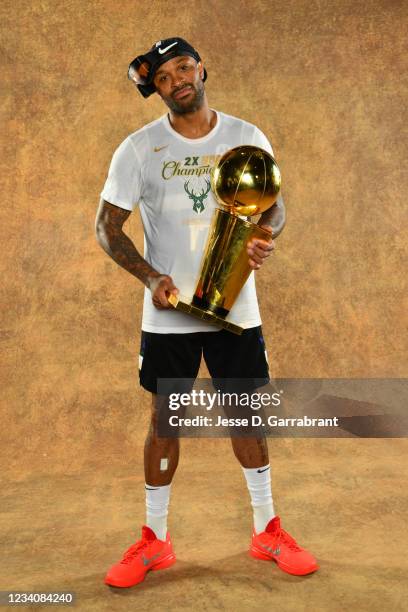 Tucker of the Milwaukee Bucks poses for a portrait with the Larry O'Brien Trophy after winning Game Six of the 2021 NBA Finals against the Phoenix...