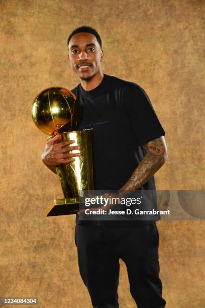 Jeff Teague of the Milwaukee Bucks poses for a portrait with the Larry O'Brien Trophy after winning Game Six of the 2021 NBA Finals against the...