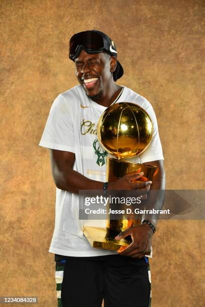 Jrue Holiday of the Milwaukee Bucks poses for a portrait with the Larry O'Brien Trophy after winning Game Six of the 2021 NBA Finals against the...