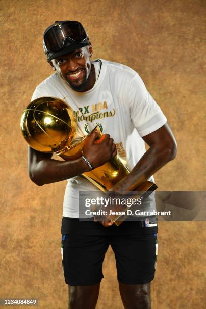 Bobby Portis of the Milwaukee Bucks poses for a portrait with the Larry O'Brien Trophy after winning Game Six of the 2021 NBA Finals against the...