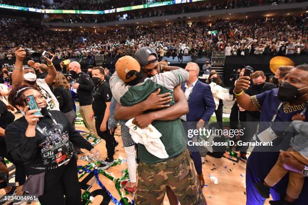 Khris Middleton of the Milwaukee Bucks and his father hug after winning Game Six of the 2021 NBA Finals against the Phoenix Suns on July 20, 2021 at...