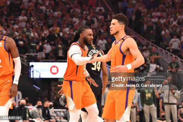 Jae Crowder of the Phoenix Suns and Devin Booker of the Phoenix Suns high-five during Game Six of the 2021 NBA Finals on July 20, 2021 at Fiserv...
