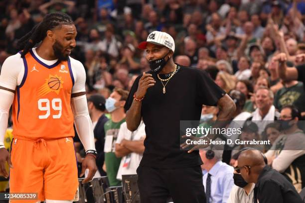 Jae Crowder of the Phoenix Suns and Former NBA Player, Brandon Jennings talk during Game Six of the 2021 NBA Finals on July 20, 2021 at Fiserv Forum...