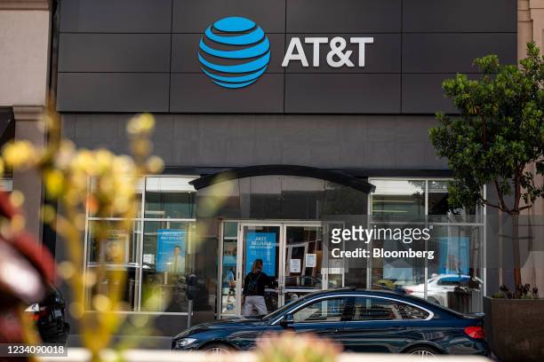 Customer enters an AT&T store in Emeryville, California, U.S., on Tuesday, July 20, 2021. AT&T Inc. Is scheduled to release earnings figures on July...