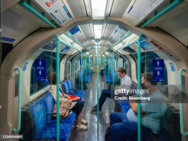 Commuters on a Waterloo & City line train on the London Underground in the City of London, U.K., on Friday, July 9, 2021. With the vast majority of...