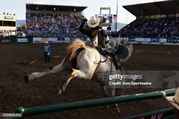 Anthony Thomas of Houston, TX rides Moon Shadow during the Reno Rodeo Bareback Bronc Riding on Monday, June 21, 2021 at the Reno Livestock Events...