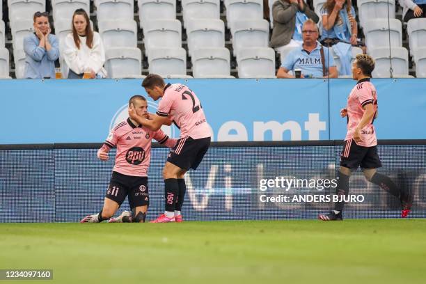 Helsinki's Finnish forward Roope Riski celebrates his 1-1 goal during the UEFA Champions League qualifying football match between Malmo and HJK...