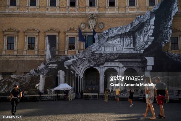 General view shows the art installation "Punto di Fuga" by the French contemporary artist JR, on the facade of Palazzo Farnese, on July 21, 2021 in...