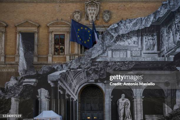 General view shows the art installation "Punto di Fuga" by the French contemporary artist JR, on the facade of Palazzo Farnese, on July 21, 2021 in...