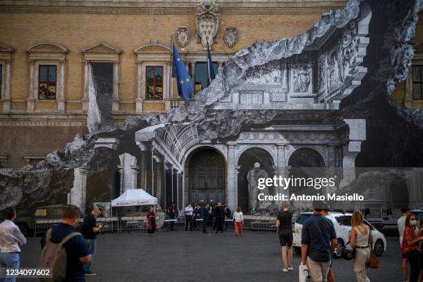 General view shows the art installation "Punto di Fuga" by the French contemporary artist JR, on the facade of Palazzo Farnese, on July 21, 2021 in...