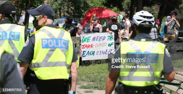 Toronto, ON- July 21 - Police and private security fence off Lamport Stadium Park West near Dufferin and King as they begin to clear a homeless...