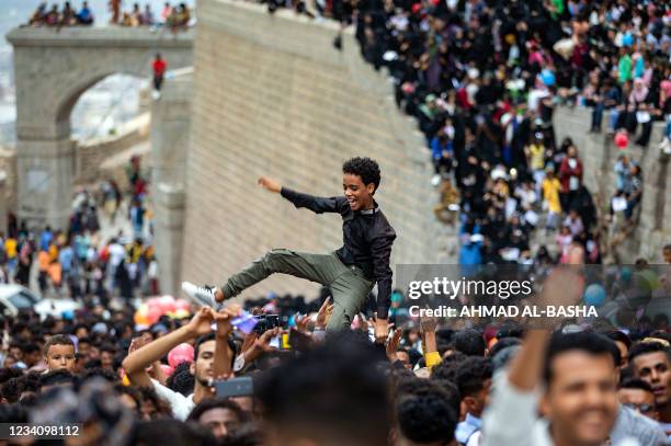 Yemenis gather at the historic 12th century citadel of al-Qahira in Yemen's third city of Taez, on July 21 during the celebrations of the Muslim...