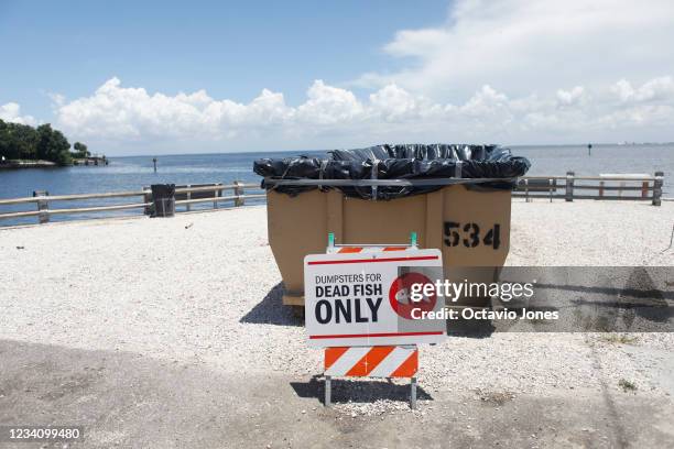 Sign is posted for depositing dead marine life from the Red Tide bacteria into dumpsters, is seen at Bay Vista Park on July 21, 2021 in St...