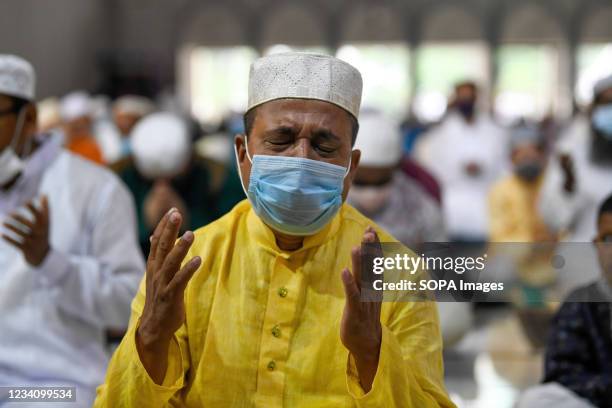 Muslim offers prayers to mark the start of the Muslim festival Eid al-Adha or the 'Festival of Sacrifice at Baitul Mukarram National Mosque in Dhaka.