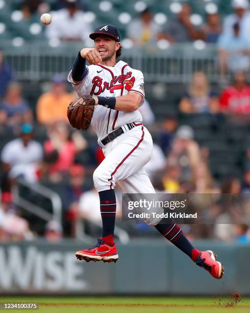 Dansby Swanson of the Atlanta Braves throws to first base in the fifth inning against the San Diego Padres during game two of a doubleheader at...