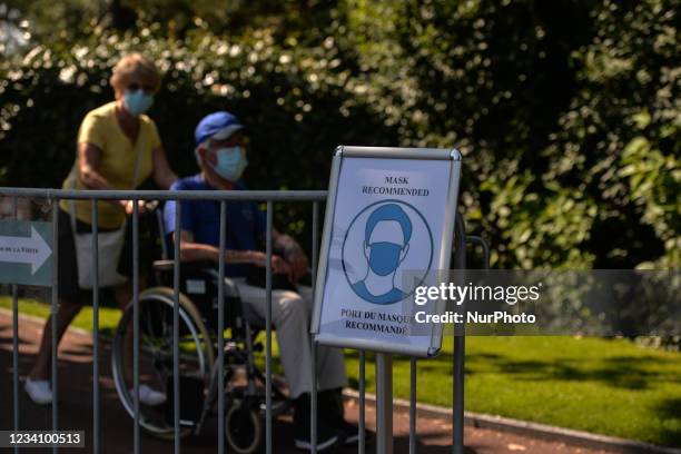 Visitors wearing face masks exiting the Normandy American Cemetery in Colleville-sur-Mer. On Wednesday, July 21 in Bayeux, Calvados, Normandy, France.