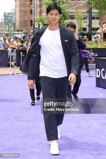 Shohei Ohtani of the Los Angeles Angels walks the purple carpet during the MLB All-Star Red Carpet Show at Downtown Colorado on Tuesday, July 13,...