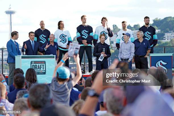 The owners and newly announced players of the Seattle Kraken are seen on stage during the 2021 NHL Expansion Draft at Gas Works Park on July 21, 2021...