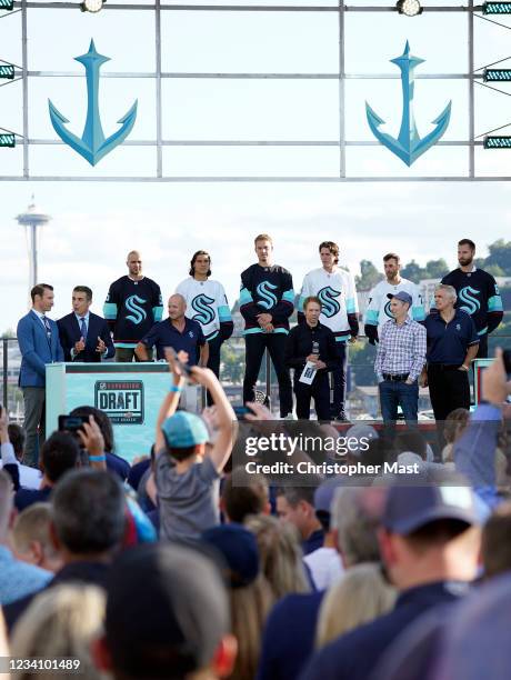 The owners and newly announced players of the Seattle Kraken are seen on stage during the 2021 NHL Expansion Draft at Gas Works Park on July 21, 2021...