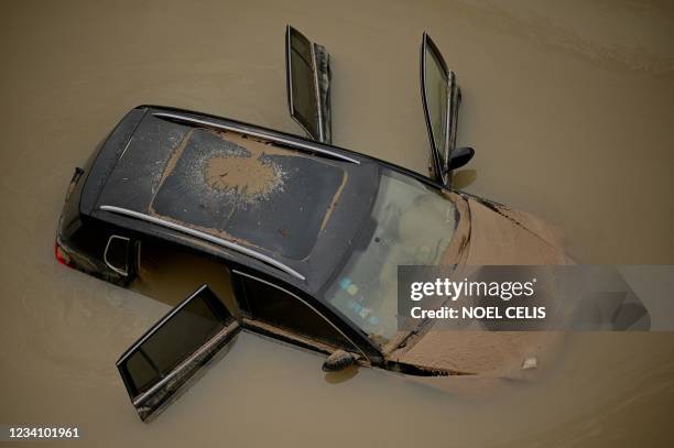 Car sits in floodwaters following heavy rains, in Zhengzhou in China's central Henan province on July 22, 2021.
