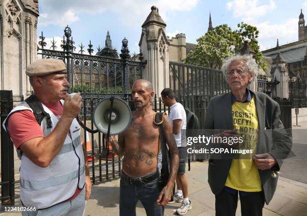 Former soldier Nick Trotsky, wearing an elite forces beret speaks through a megaphone, during the demonstration. English weather forecaster,...