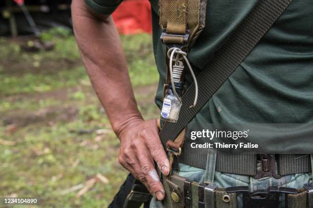 Soldier from the Karen National Liberation Army , the military arm of the Karen National Union , carries a device designed to test the electrical...