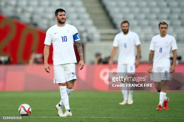 France's forward Andre-Pierre Gignac reacts to Mexico's opening goal during the Tokyo 2020 Olympic Games men's group A first round football match...