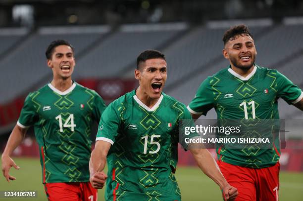 Mexico's forward Uriel Antuna celebrates with Mexico's forward Alexis Vega and Mexico's midfielder Erick Aguirre after scoring the third goal during...