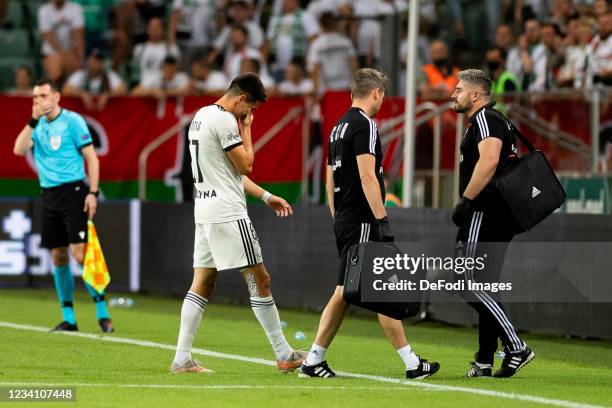 Bartosz Kapustka of Legia Warschau injured during the UEFA Champions League 2021-22 Second Qualifying Round First Leg between Legia Warsaw and Flora...