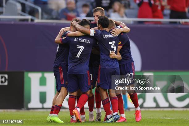 Chicago Fire midfielder Gaston Gimenez celebrates with fans and teammates after scoring a goal in action during a game between the Chicago Fire and...