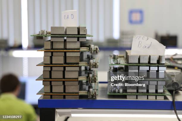 Labels reading 'bad' and 'very bad' above broken hash boards awaiting repair inside the 3Logic mining equipment service center, in Moscow, Russia, on...