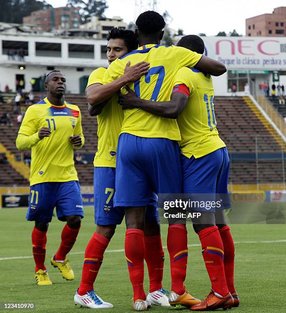 Ecuadorean footballer Jaime Ayovi celebrates with teammates after scoring against Jamaica during their FIFA friendly match at Atahualpa Stadium in...