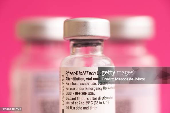 In this photo illustration vials of Pfizer BioNTech vaccine In this photo illustration vials of Pfizer BioNTech vaccine