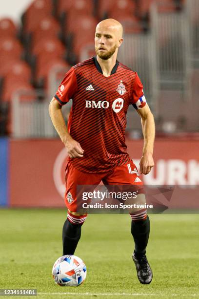 Toronto FC midfielder Michael Bradley runs with the ball during MLS Soccer regular season game between the New York Red Bulls and the Toronto FC on...