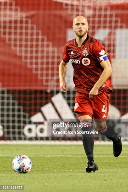 Toronto FC midfielder Michael Bradley runs with the ball during MLS Soccer regular season game between the New York Red Bulls and the Toronto FC on...