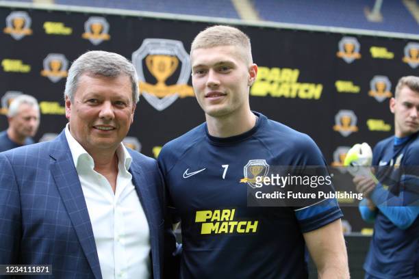 Parimatch PR director Vadym Misiura and forward Artem Dovbyk of SC Dnipro-1 are pictured before the start of the 2021/2022 Ukrainian Premier League...