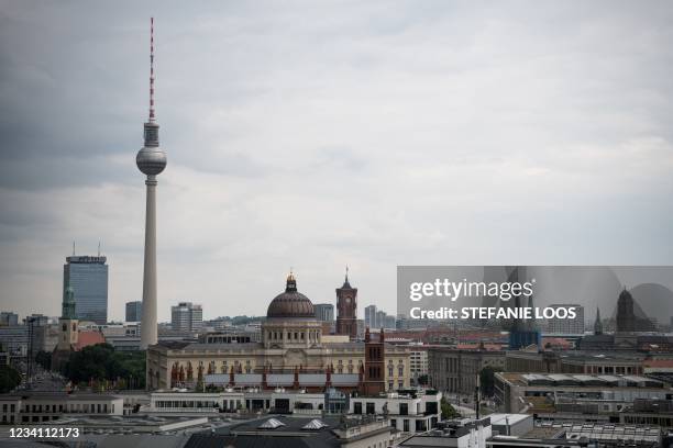 Berlin's landmark Television Tower , the rebuilt Berlin Palace which houses the Humboldt Forum and Red City Hall are seen in Berlin on July 22, 2021.