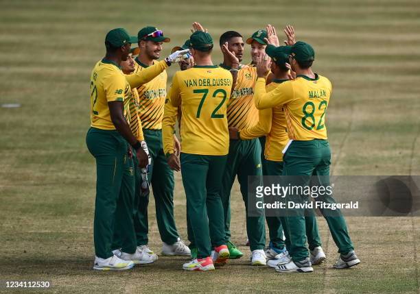 Belfast , United Kingdom - 22 July 2021; Quinton de Kock of South Africa is congratulated by team-mates after catching out Andrew Balbirnie of...