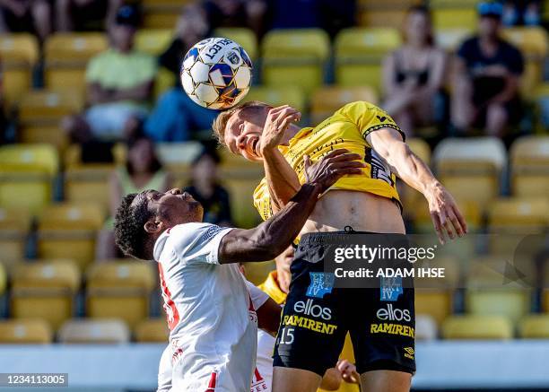 Milsami's Cameroon midfielder Vitus Amougui and Elfsborg's Finnish defender Leo Vaisanen vie for a header during the UEFA Champions League qualifying...