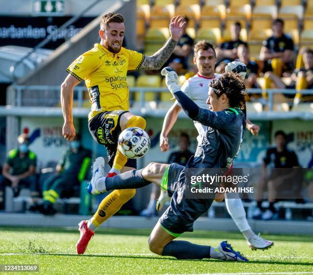 Elfsborg's Swedish forward Rasmus Alm and Milsami's Moldovan goalkeeper Emil Timbur vie for the ball during the UEFA Champions League qualifying...