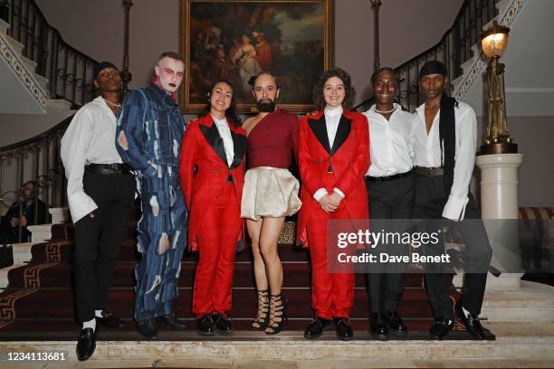 Charles Jeffrey and Lyall Hakaraia pose with models Prince, Majesty and Ryan and two ushers wearing suits designed by Charles Jeffrey LOVERBOY at the...