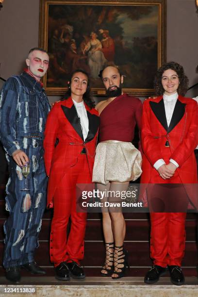Charles Jeffrey and Lyall Hakaraia pose with models Prince, Majesty and Ryan and two ushers wearing suits designed by Charles Jeffrey LOVERBOY at the...
