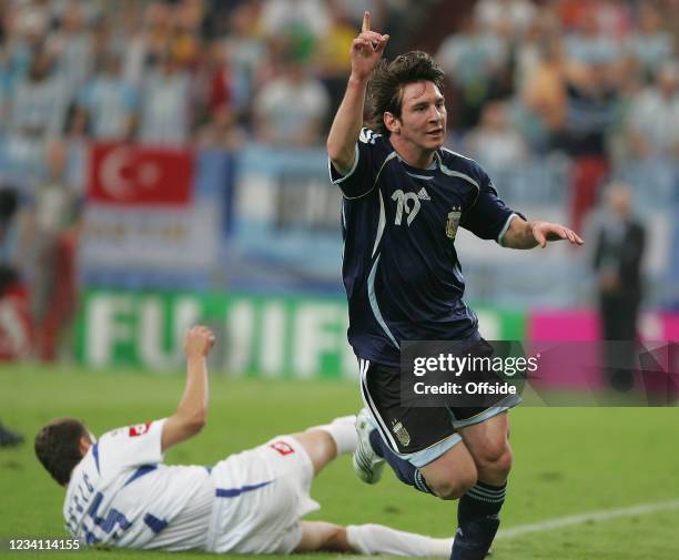 World Cup 2006, Argentina v Serbia & Montenegro, Lionel Messi of Argentina celebrates his goal as Milan Dudic of Serbia & Montenegro rolls on the...