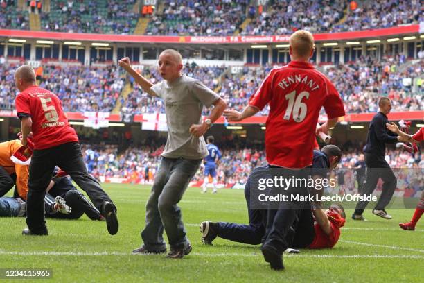 Football Association Community Shield, Liverpool v Chelsea, Liverpool fans invade the pitch to celebrate the winning goal.