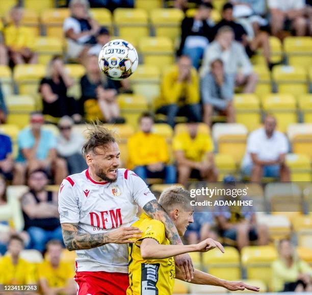 Elfsborg's Swedish midfielder Alexander Bernhardsson and Milsami's Moldovan defender Petru Racu vie for a header during the UEFA Champions League...