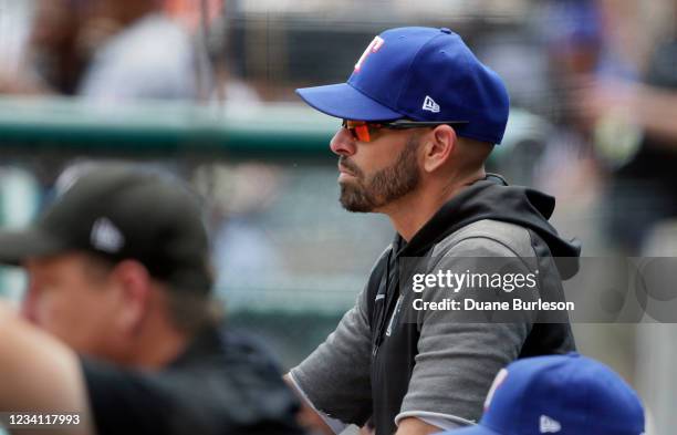 Manger Chris Woodward of the Texas Rangers watches from the dugout during the second inning of a game against the Detroit Tigers at Comerica Park on...