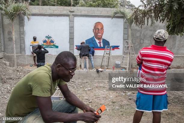 Local artists are painting murals in tribute to slain president Jovenel Moise as locals come to see the preparations in front of the place where he...